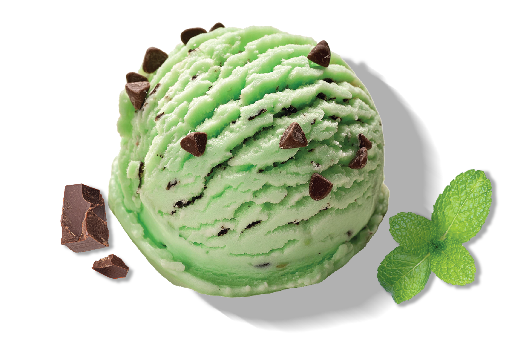 A scoop of Rivo green mint chip protein ice cream with a chunk of chocolate and a mint leaf.