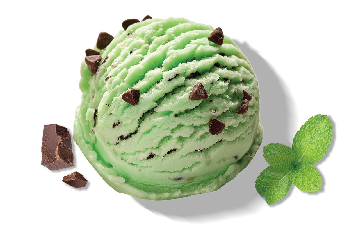A scoop of Rivo green mint chip protein ice cream with a chunk of chocolate and a mint leaf.