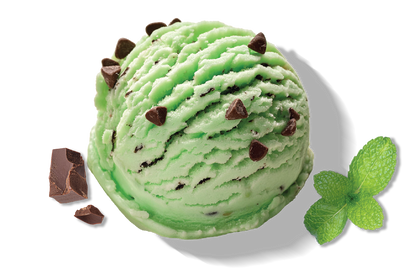 A scoop of Rivo green mint chip protein ice cream with a chunk of chocolate and a mint leaf.