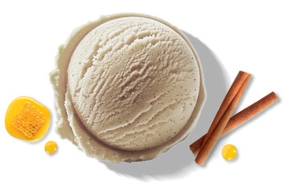 A scoop of Rivo Honey Cinnamon protein ice cream with honey and cinnamon sticks.